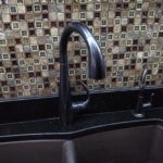 Kitchen faucet filter backsplash