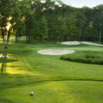 Golf course with sand traps on a sunny day